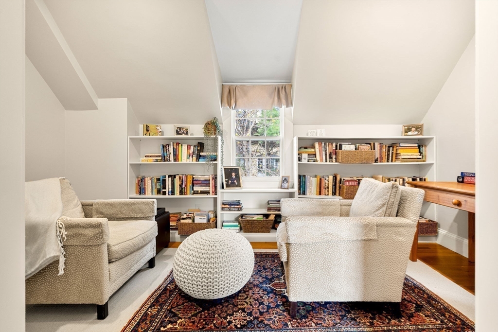 40 Morton Street Andover, MA 01810 - Photo 23 of 32 a living room with furniture and a book shelf