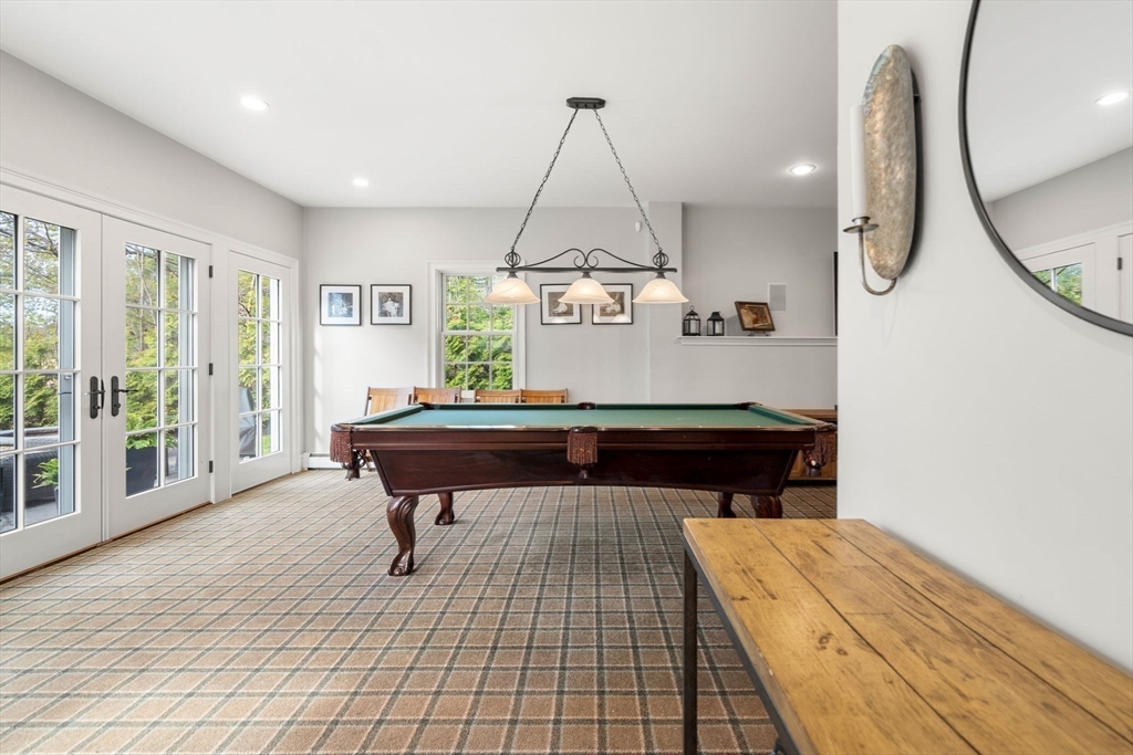 40 Morton Street Andover, MA 01810 - Photo 27 of 32 a room with gym equipment and wooden floor