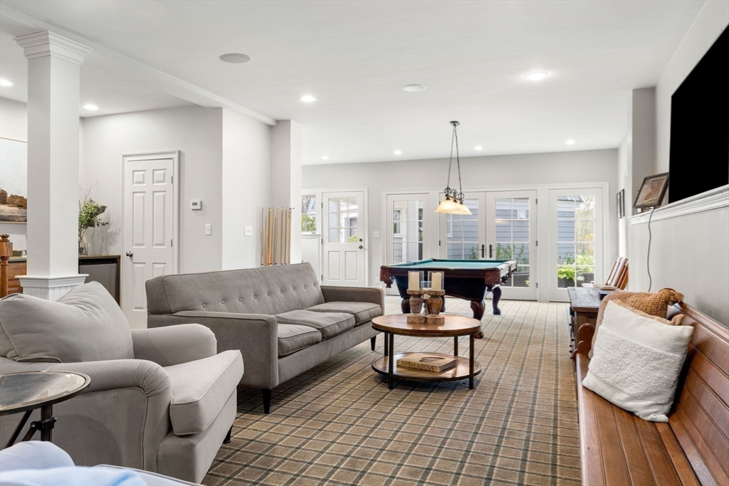 40 Morton Street Andover, MA 01810 - Photo 28 of 32 a living room with furniture and a chandelier