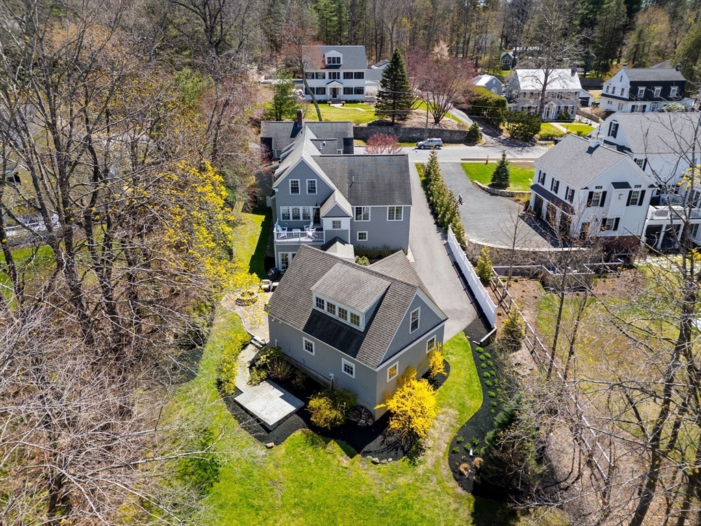 40 Morton Street Andover, MA 01810 - Photo 3 of 32 a aerial view of a house with swimming pool and outdoor seating
