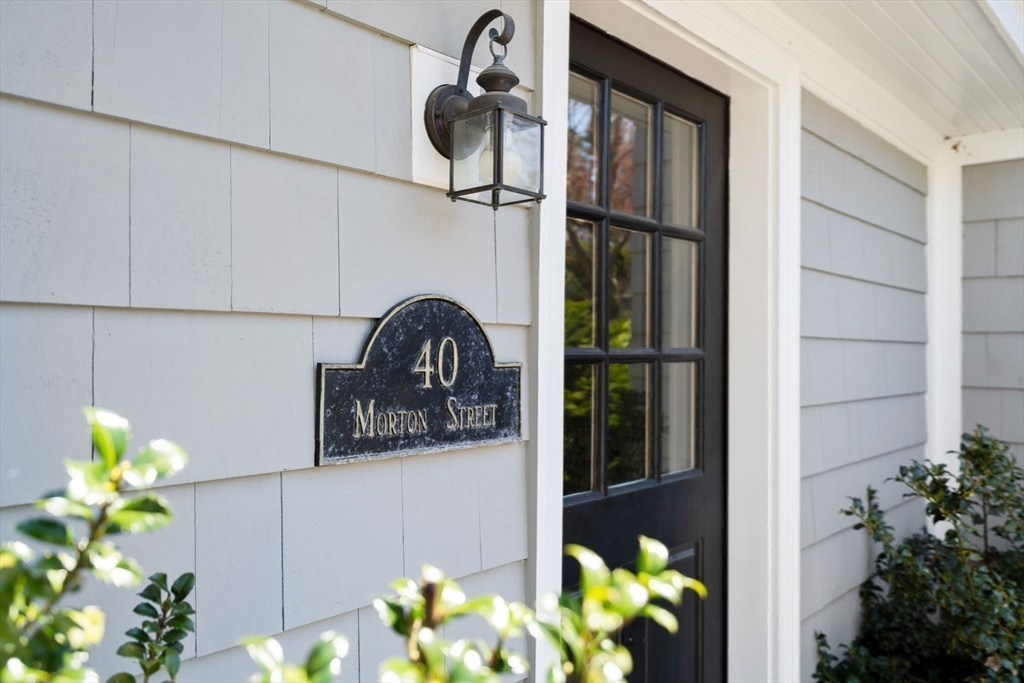 40 Morton Street Andover, MA 01810 - Photo 31 of 32 a vase of flowers sitting on a floor