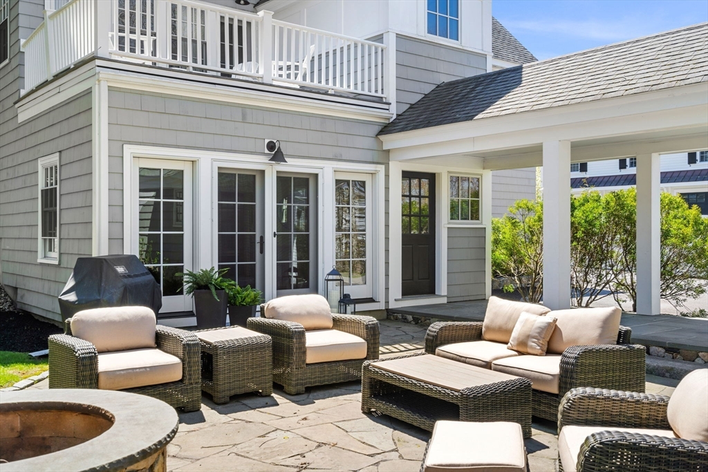 40 Morton Street Andover, MA 01810 - Photo 6 of 32 a balcony with furniture and outdoor seating