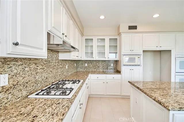 a close view of a sink and cabinets