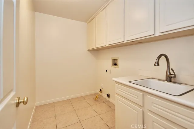 a view of a hallway with wooden floor and entryway