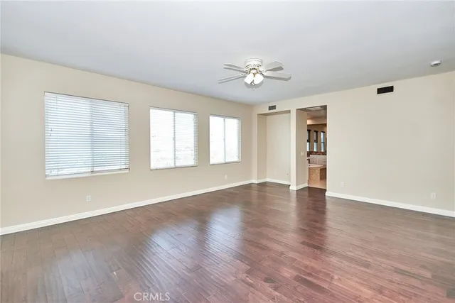 a large spacious bathroom with a tub sink and mirror