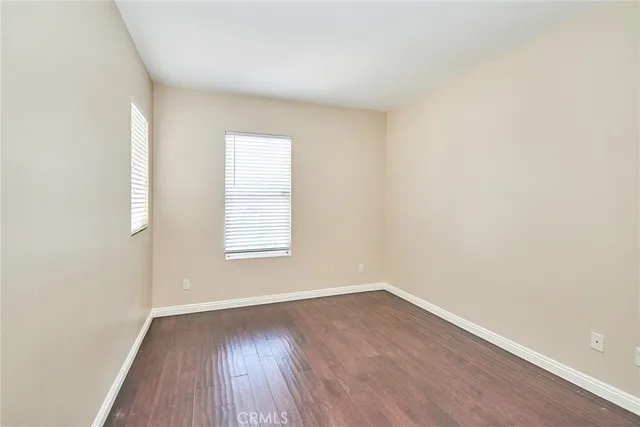 a view of a patio with a table chairs and a backyard