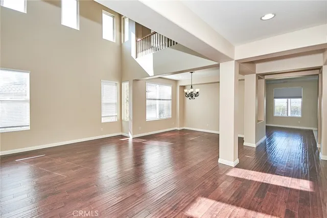 a view of an entryway with wooden floor and windows