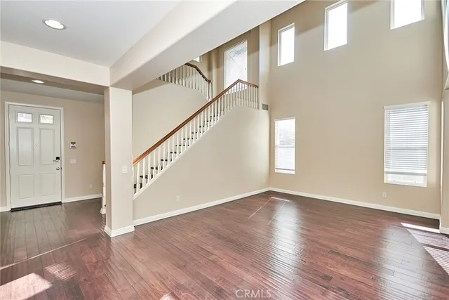 a view of an entryway with wooden floor