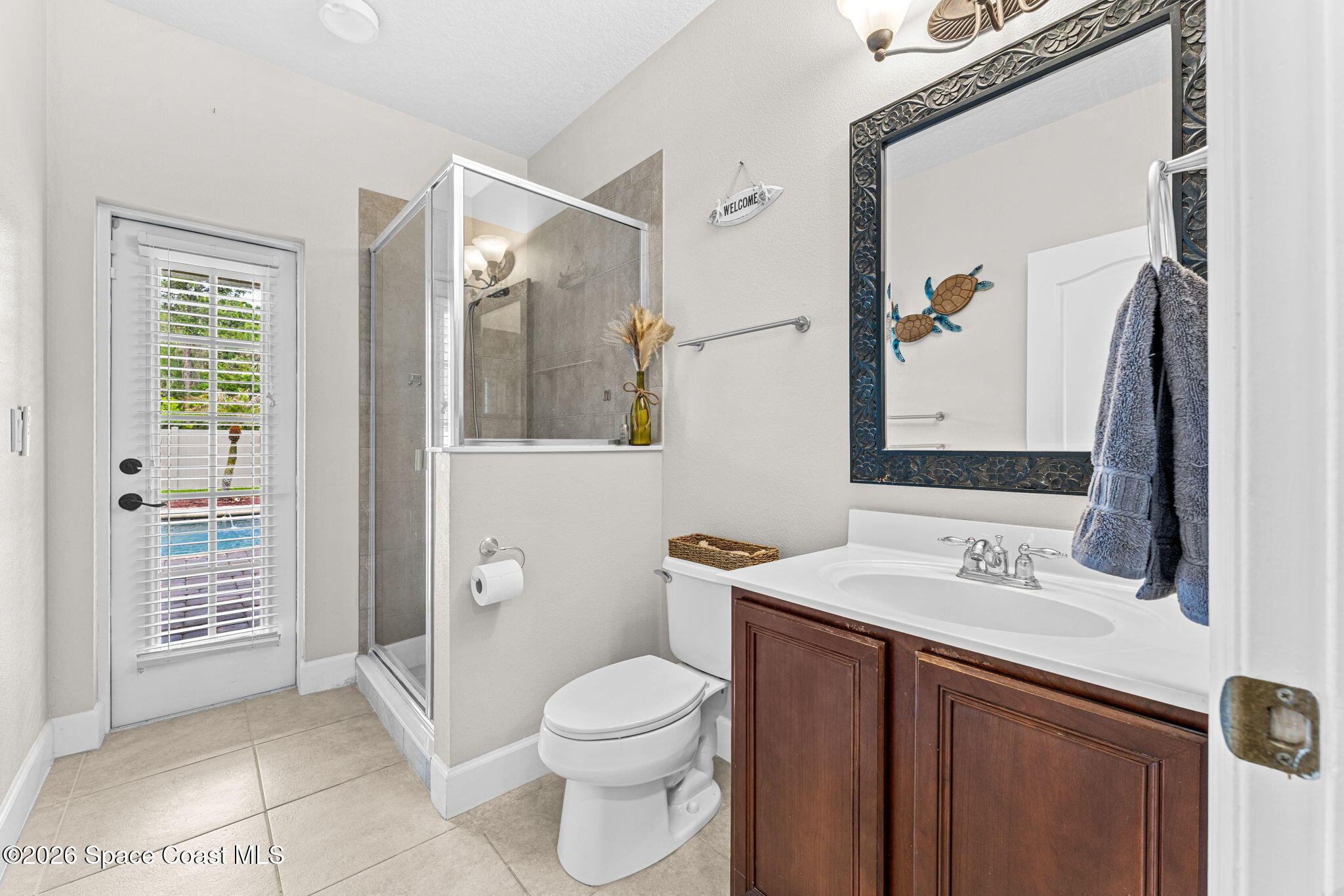 1390 Talon Way Melbourne, FL 32934 - Photo 29 of 60 Downstairs guest suite pool bath