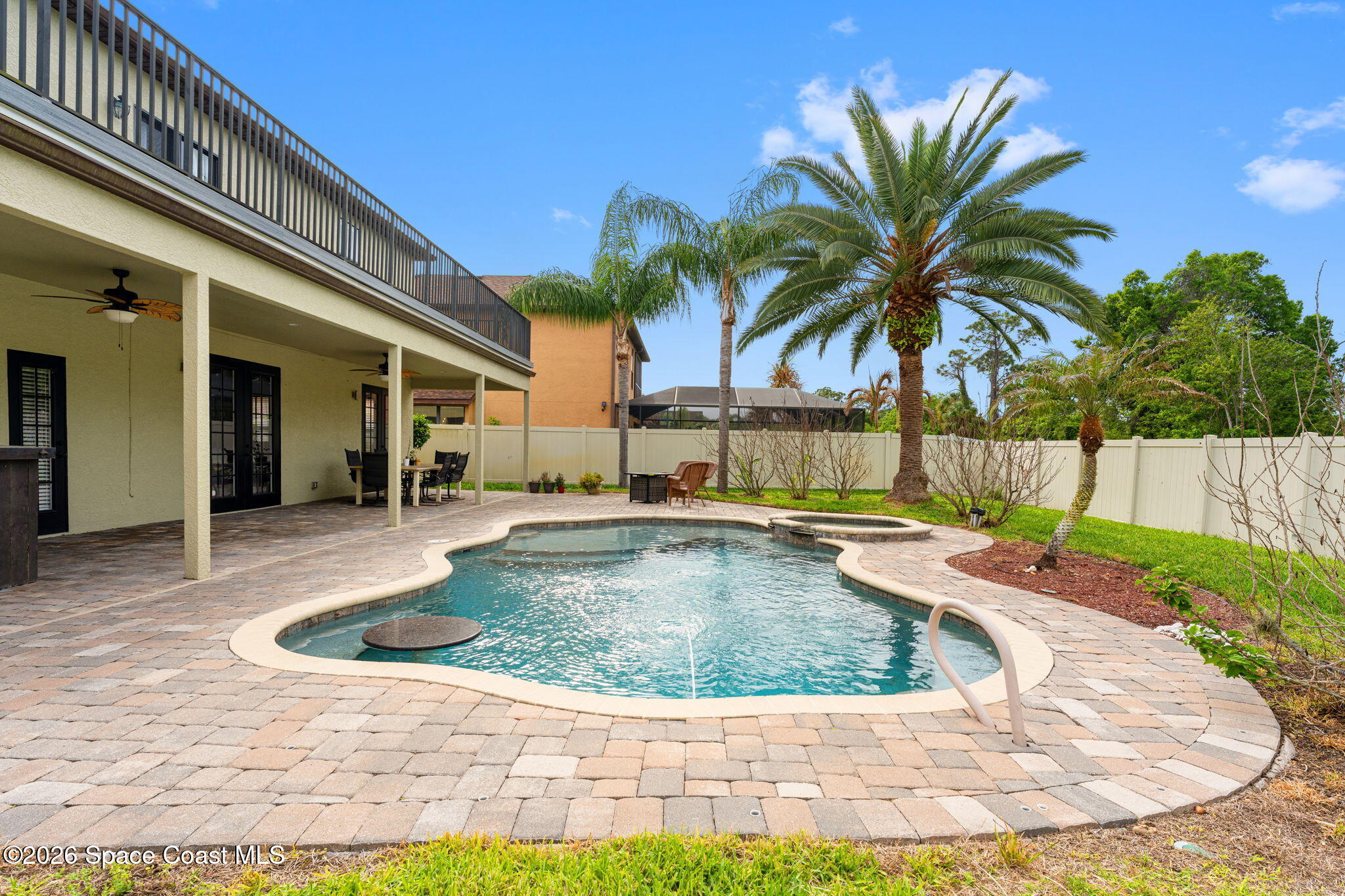 1390 Talon Way Melbourne, FL 32934 - Photo 42 of 60 Pool with hot tub and built in table