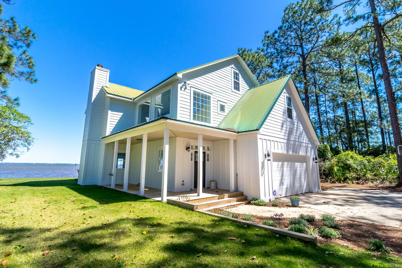 72 Carolyn Lane Santa Rosa Beach, FL 32459 - Photo 1 of 25 a view of a house with yard and sitting area