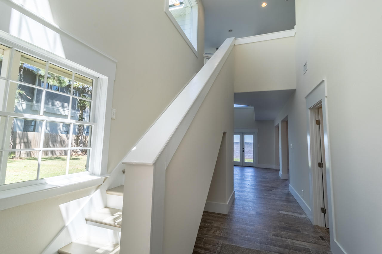 72 Carolyn Lane Santa Rosa Beach, FL 32459 - Photo 2 of 25 a view of entryway and kitchen with wooden floor