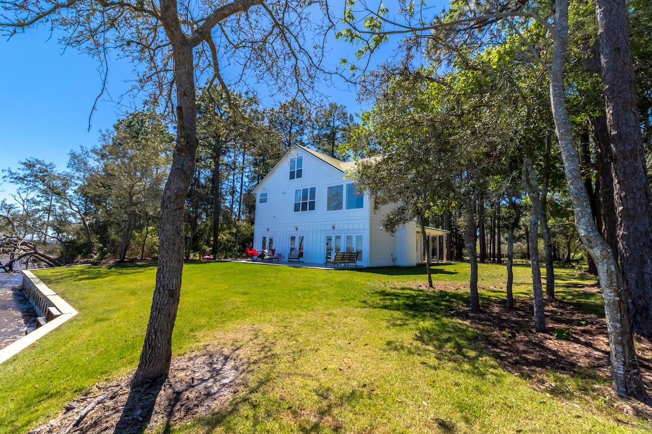72 Carolyn Lane Santa Rosa Beach, FL 32459 - Photo 16 of 25 a view of a house with backyard and trees