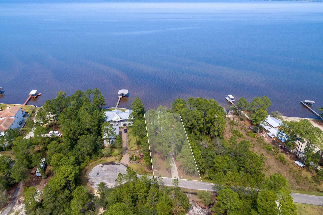 72 Carolyn Lane Santa Rosa Beach, FL 32459 - Photo 20 of 25 an aerial view of a house with lots of palm trees