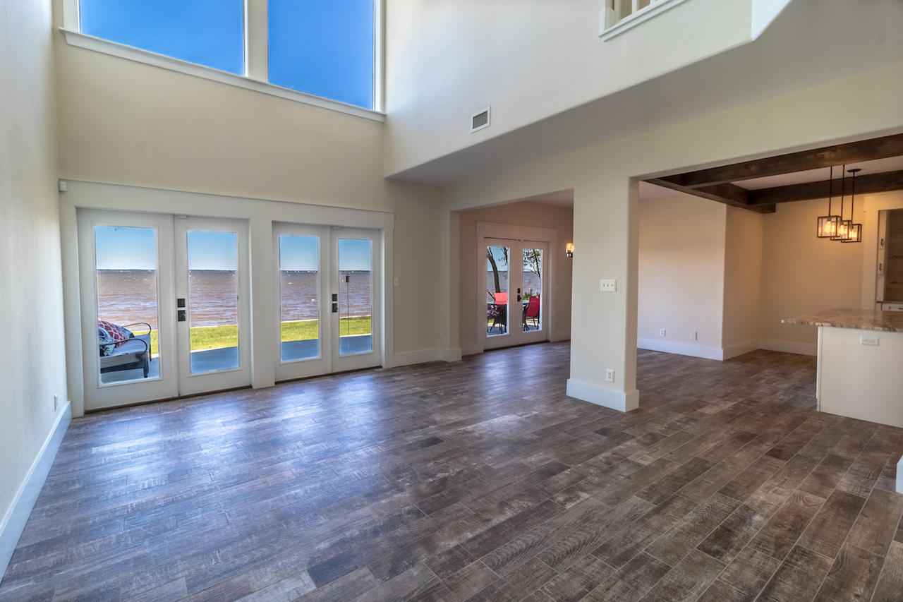 72 Carolyn Lane Santa Rosa Beach, FL 32459 - Photo 3 of 25 a view of an empty room with a window and wooden floor