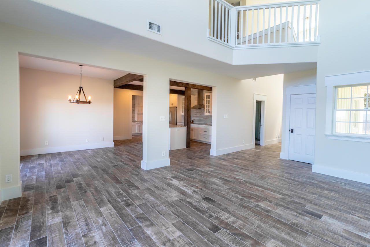 72 Carolyn Lane Santa Rosa Beach, FL 32459 - Photo 4 of 25 a view of empty room with wooden floor and window