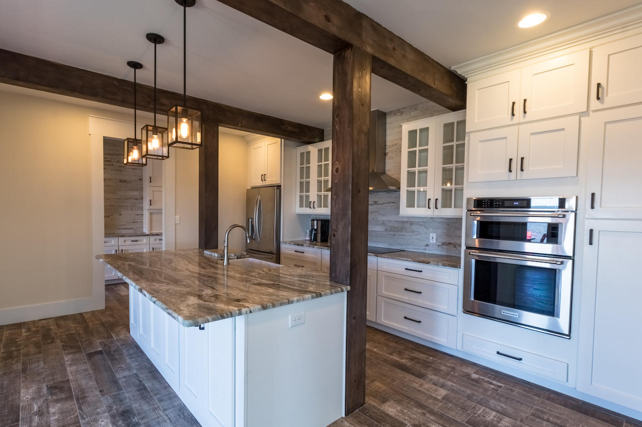 72 Carolyn Lane Santa Rosa Beach, FL 32459 - Photo 5 of 25 a kitchen with stainless steel appliances granite countertop a stove and a sink