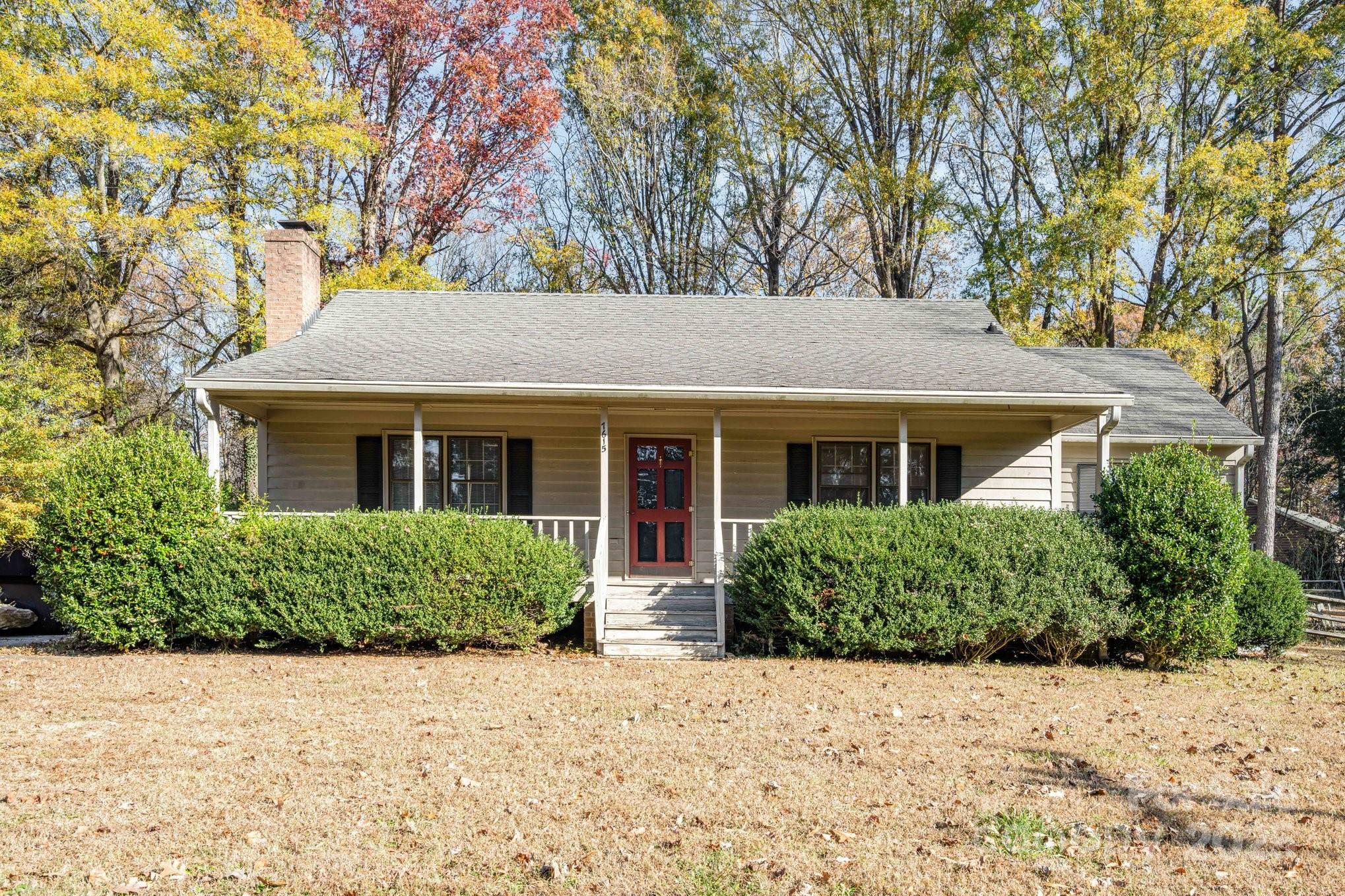 7615 Alexander Road Charlotte, NC 28270 - Photo 1 of 19 front view of a house and a yard