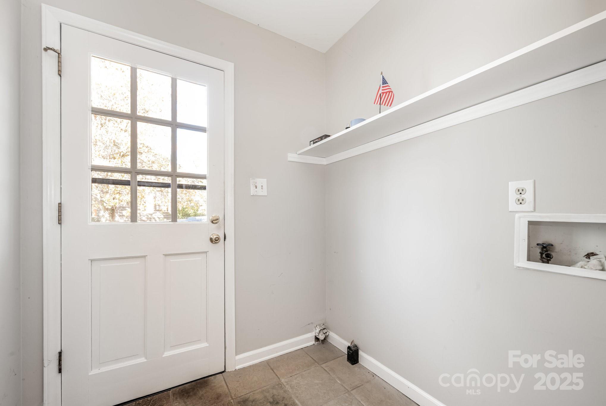 7615 Alexander Road Charlotte, NC 28270 - Photo 11 of 19 a view of a closet in an empty room