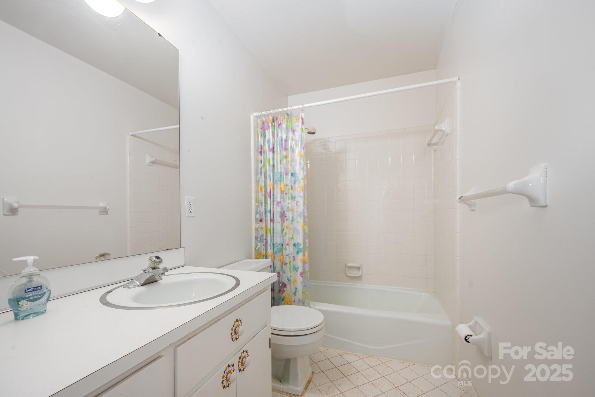 7615 Alexander Road Charlotte, NC 28270 - Photo 16 of 19 a bathroom with a sink a toilet and shower