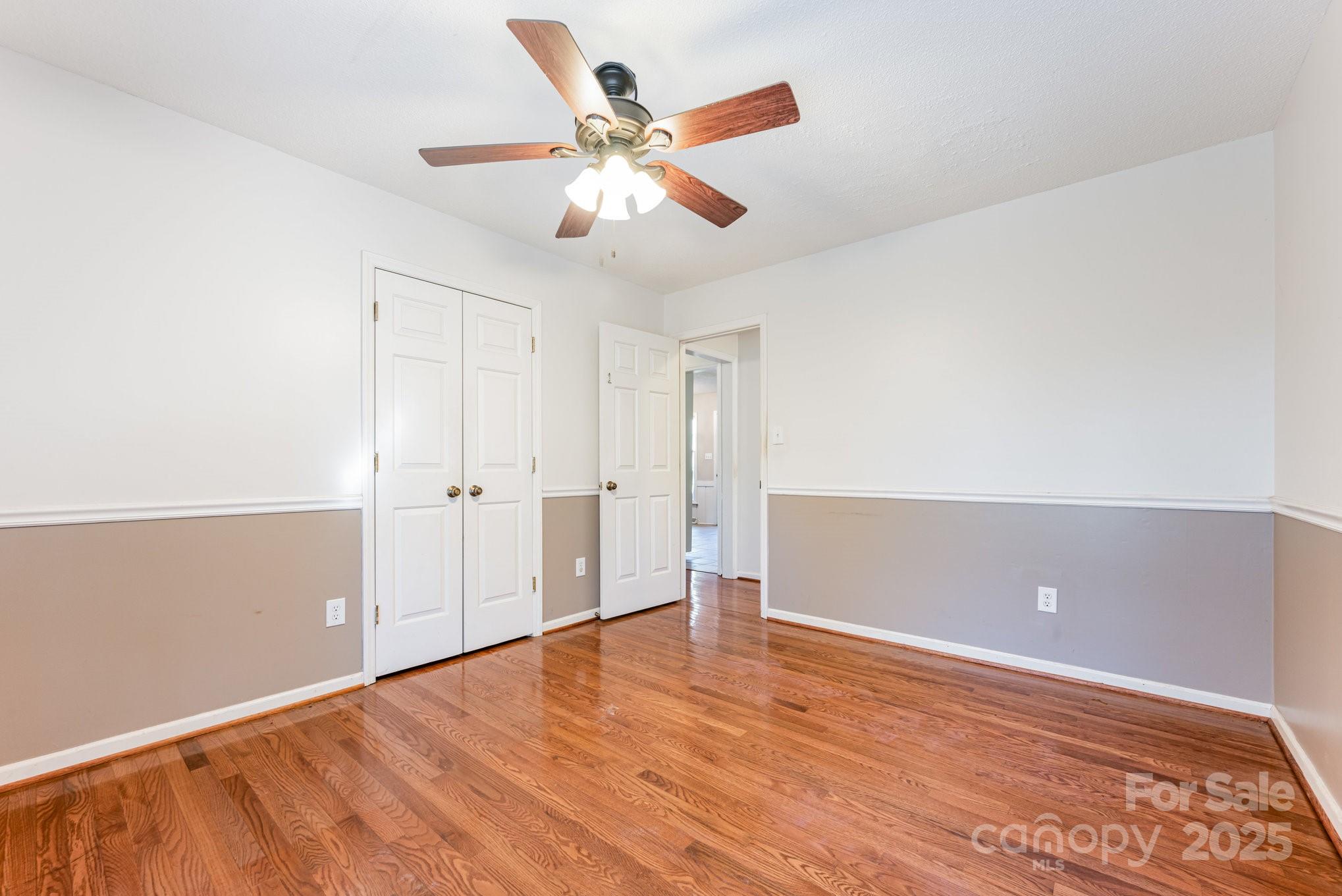 7615 Alexander Road Charlotte, NC 28270 - Photo 18 of 19 a view of an empty room with wooden floor