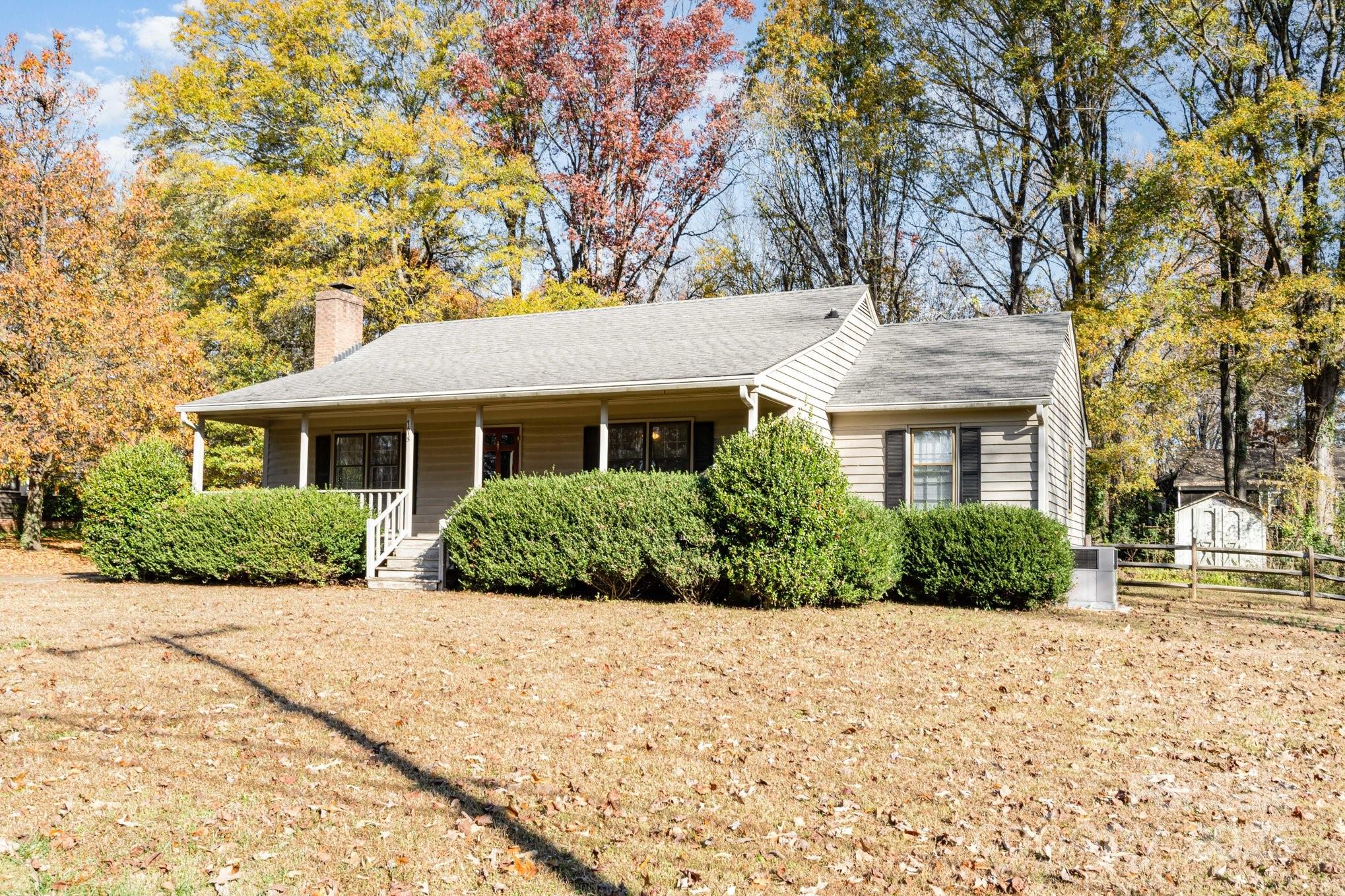 7615 Alexander Road Charlotte, NC 28270 - Photo 3 of 19 a front view of a house with a yard