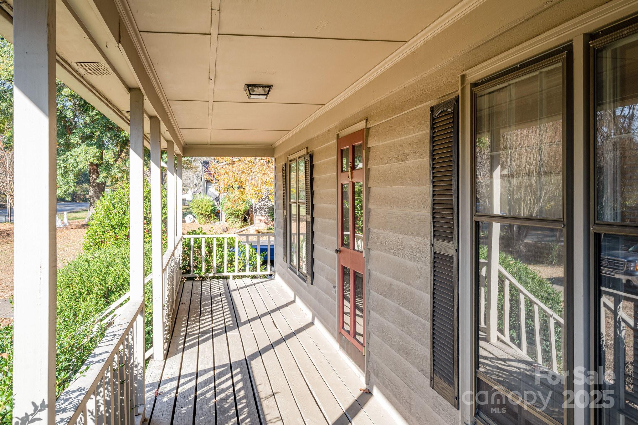 7615 Alexander Road Charlotte, NC 28270 - Photo 4 of 19 a view of a porch with wooden floor and outdoor space