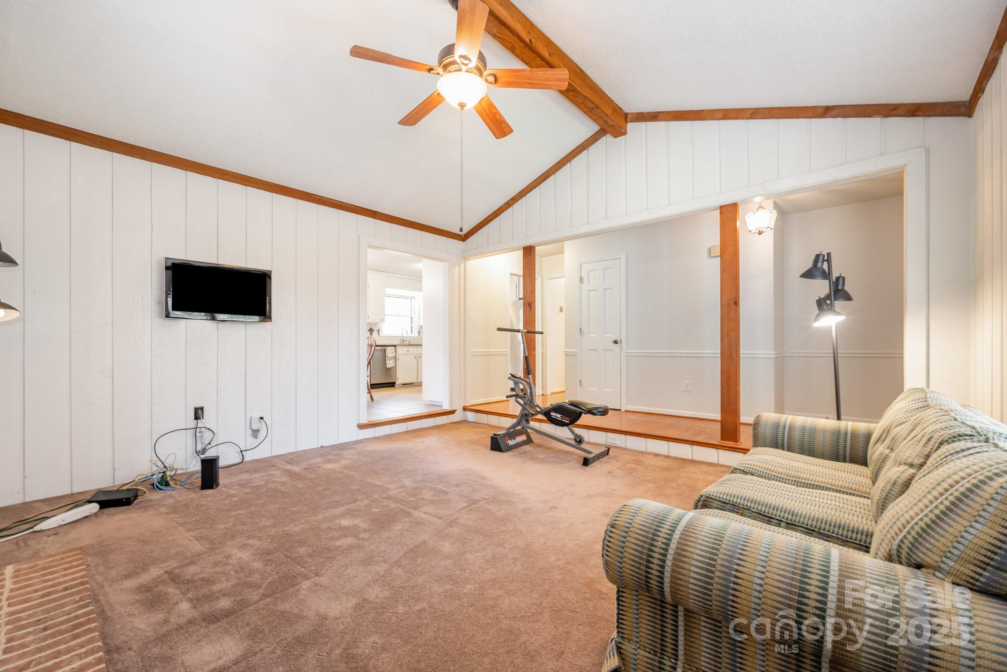7615 Alexander Road Charlotte, NC 28270 - Photo 6 of 19 a living room with furniture and a flat screen tv