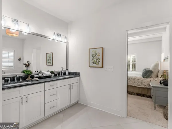 a white bath tub sitting in a en suite bathroom