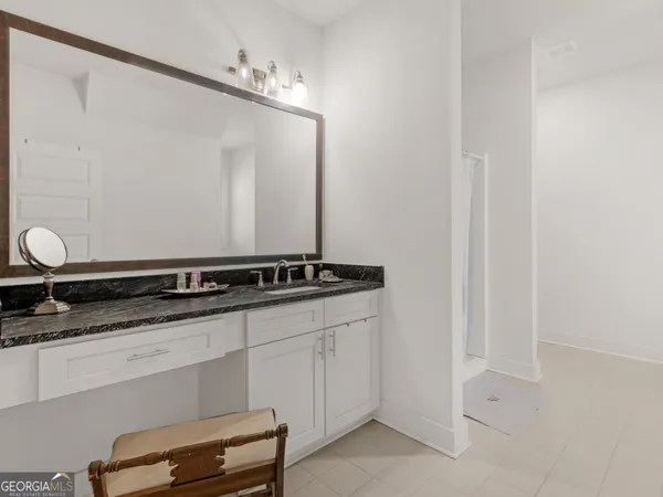a kitchen with stainless steel appliances granite countertop a stove and a refrigerator