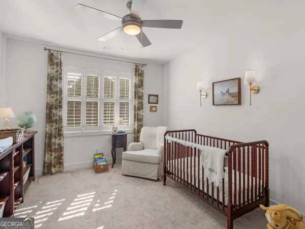 a living room with furniture and flowers