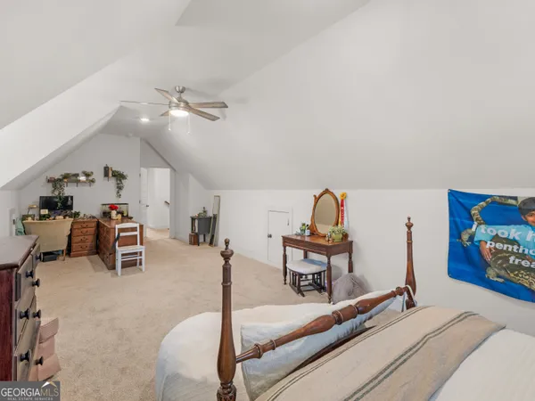 a view of a hallway with closet and toys