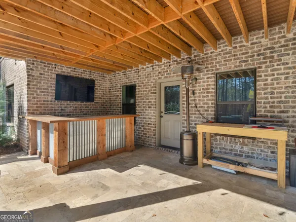 a balcony with furniture and a potted plant