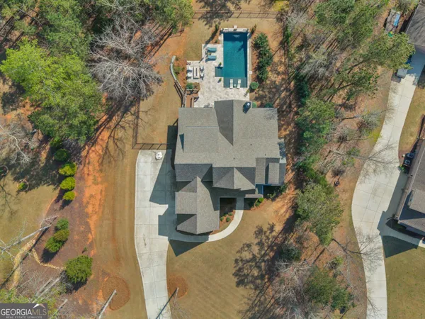 a front view of house with yard outdoor seating and barbeque oven