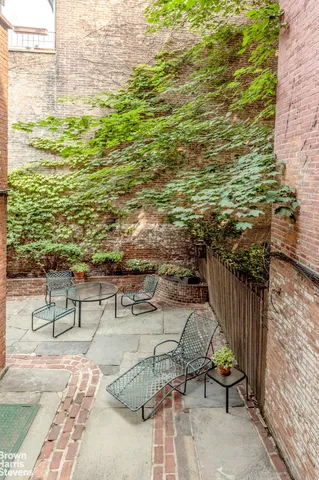 a view of a terrace with wooden floor and outdoor seating