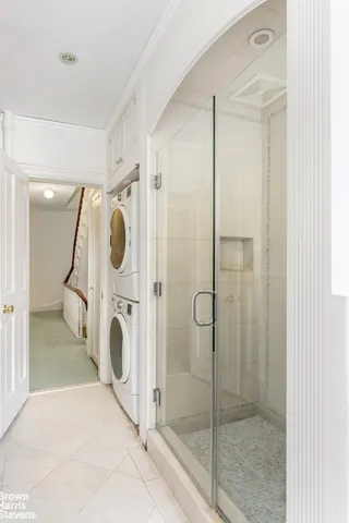 a bathroom with a shower and mirror