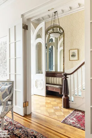 a view of a living room and entry way
