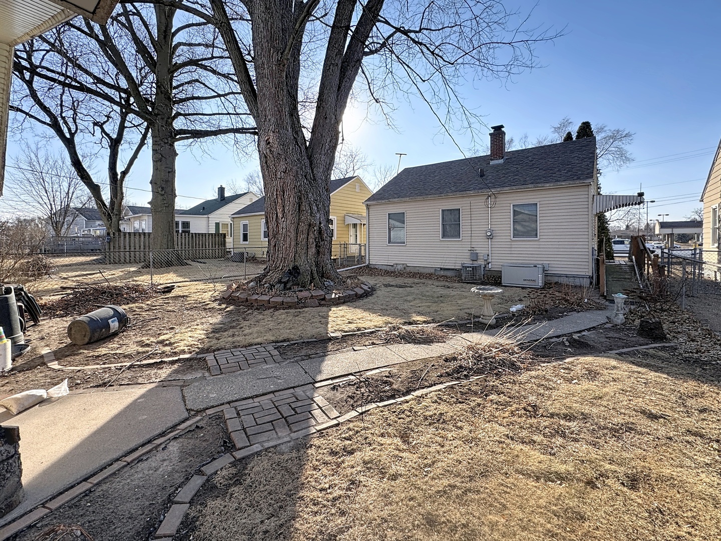 2110 2nd Street Moline, IL 61265 - Photo 5 of 5 a dirt road with an house covered with trees in front of it