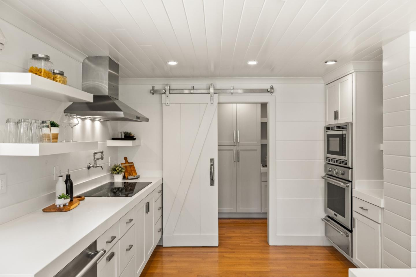 58 La Rancheria Carmel Valley, CA 93924 - Photo 11 of 36 a kitchen with stainless steel appliances a refrigerator and wooden floor