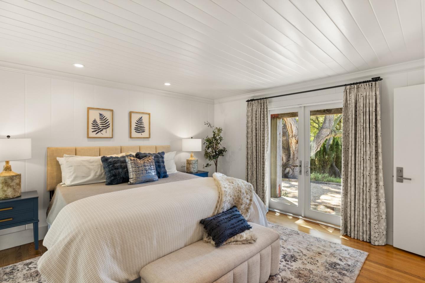 58 La Rancheria Carmel Valley, CA 93924 - Photo 13 of 36 a bedroom with a large bed and a window
