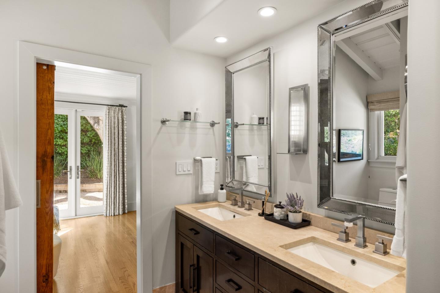 58 La Rancheria Carmel Valley, CA 93924 - Photo 15 of 36 a bathroom with a double vanity sink mirror and double