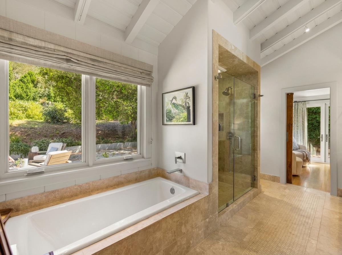 58 La Rancheria Carmel Valley, CA 93924 - Photo 16 of 36 a bathroom with a tub a sink and a shower