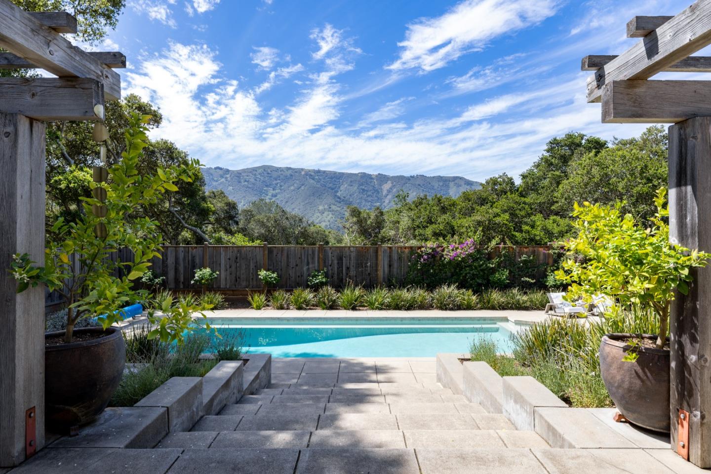 58 La Rancheria Carmel Valley, CA 93924 - Photo 24 of 36 a view of a golf course with a lake