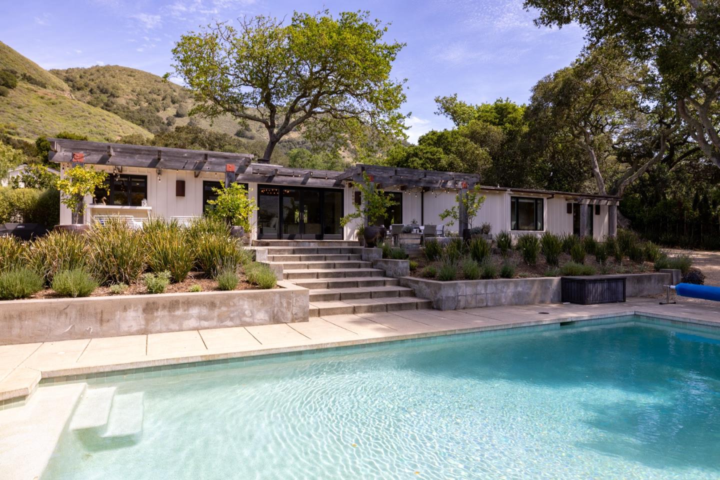 58 La Rancheria Carmel Valley, CA 93924 - Photo 25 of 36 a front view of a house with garden