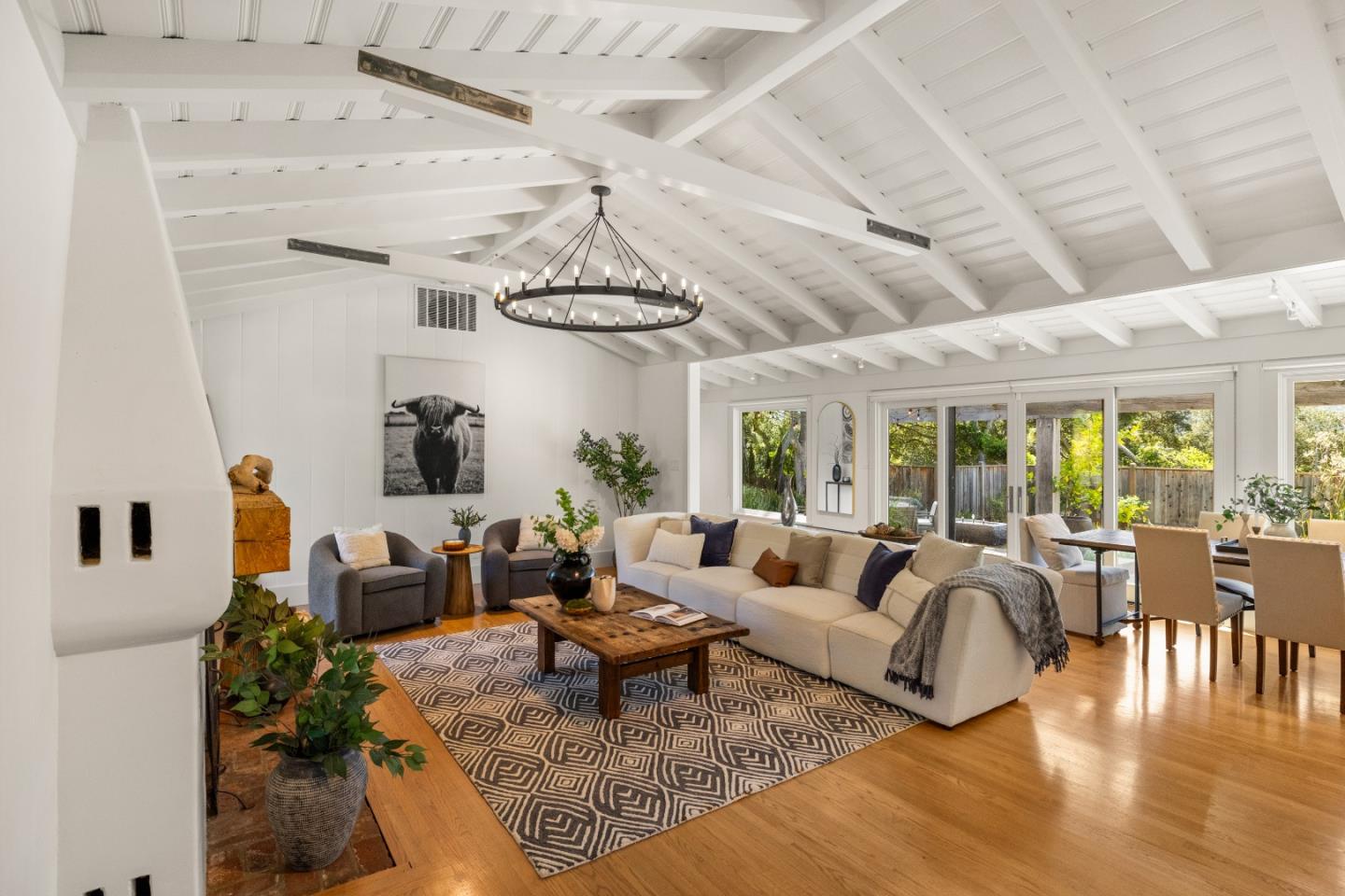 58 La Rancheria Carmel Valley, CA 93924 - Photo 3 of 36 a living room with furniture and a chandelier