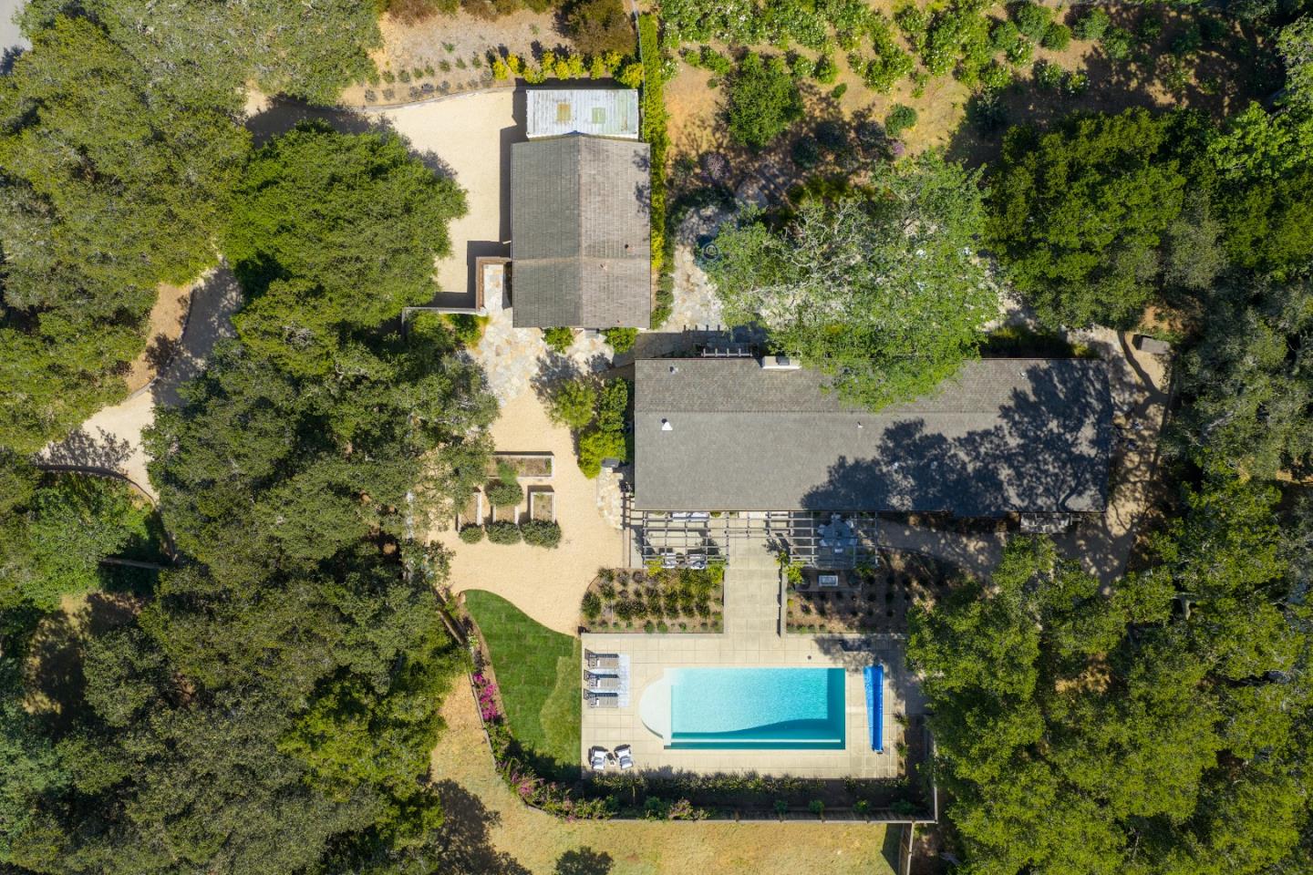 58 La Rancheria Carmel Valley, CA 93924 - Photo 34 of 36 view of a house with a yard and large trees