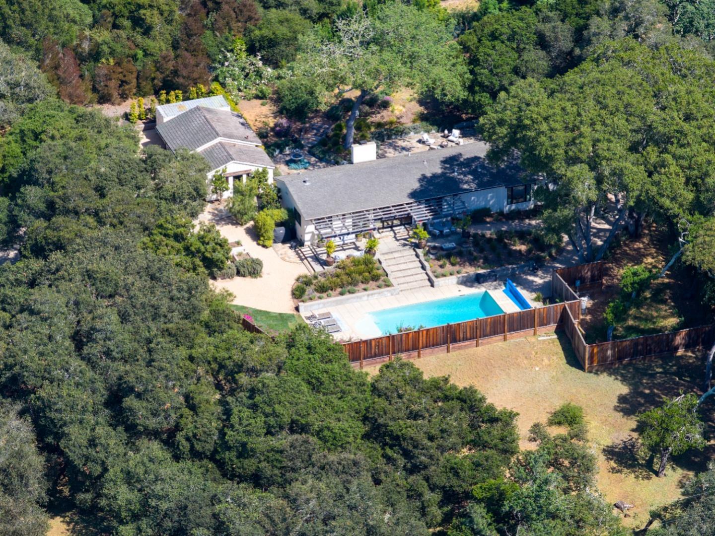 58 La Rancheria Carmel Valley, CA 93924 - Photo 35 of 36 an aerial view of a house with a yard and tennis court