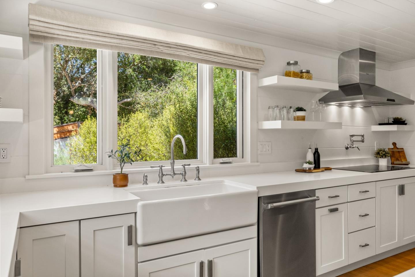 58 La Rancheria Carmel Valley, CA 93924 - Photo 10 of 36 a kitchen with cabinets a window and a sink