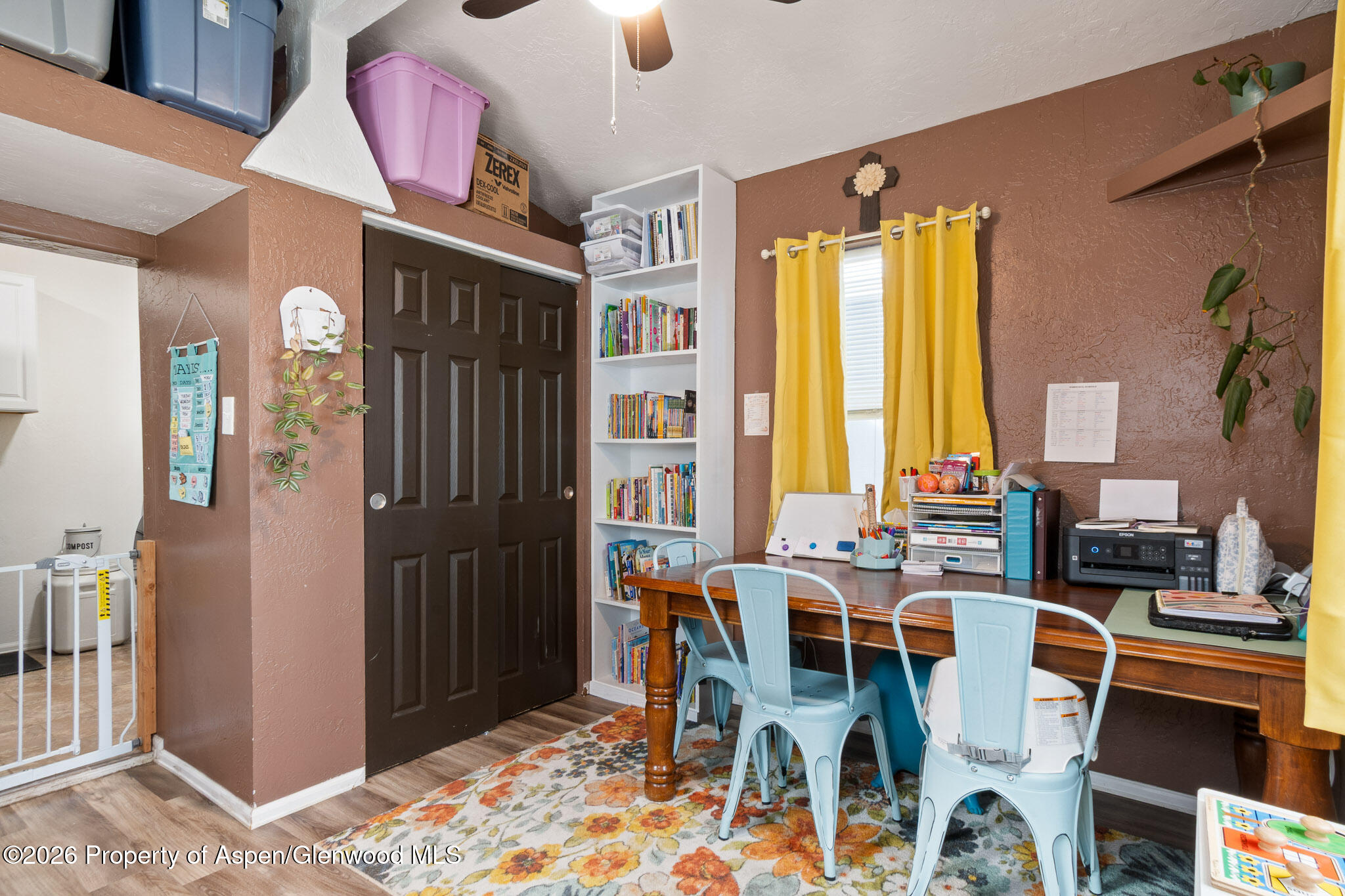 106 Cedar Circle Parachute, CO 81635 - Photo 26 of 35 a dining room with furniture window and wooden floor