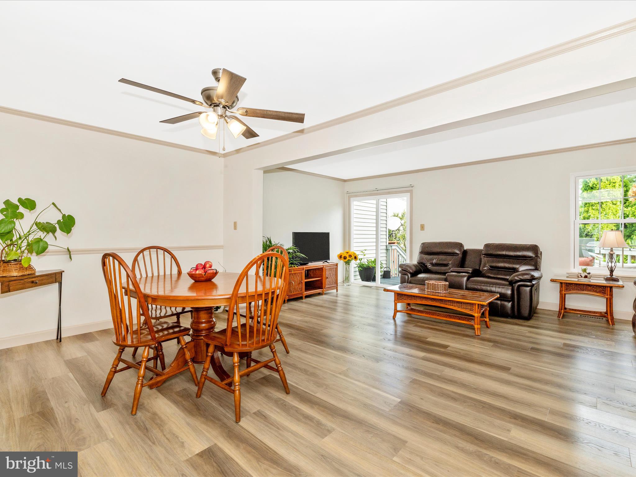 6739 Killdeer Court Frederick, MD 21703 - Photo 11 of 38 a view of a dining room with furniture window and wooden floor